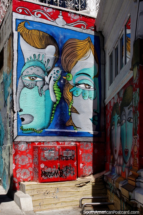 Any wall in Valparaiso is a canvas for artists and their interesting ideas, 2 large faces. (480x720px). Chile, South America.