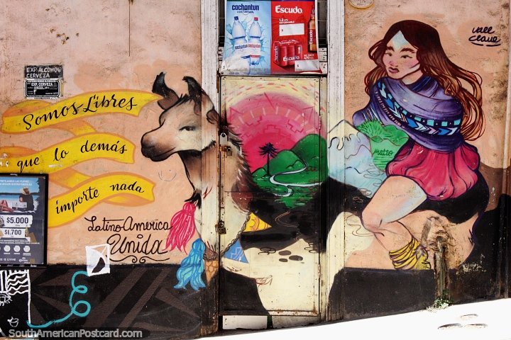 Girl rides an alpaca or llama in the green countryside, street painting on a shopfront in Valparaiso. (720x480px). Chile, South America.