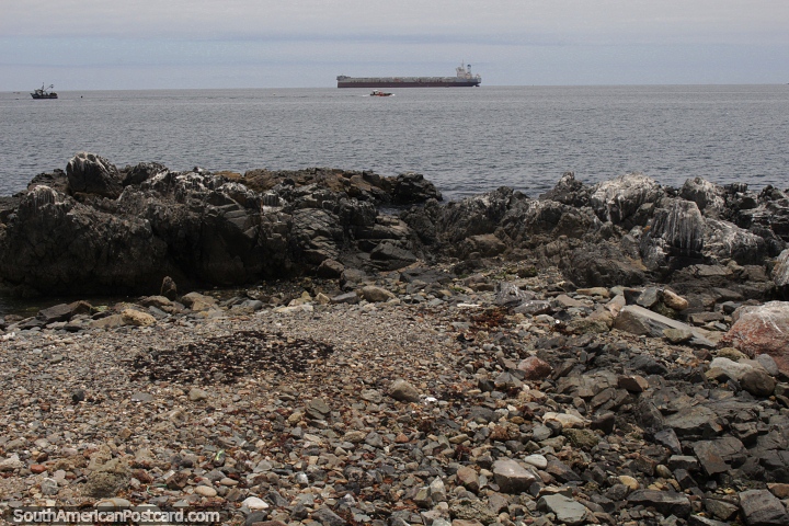 Distant ship off the rocky coastline of Caldera. (720x480px). Chile, South America.