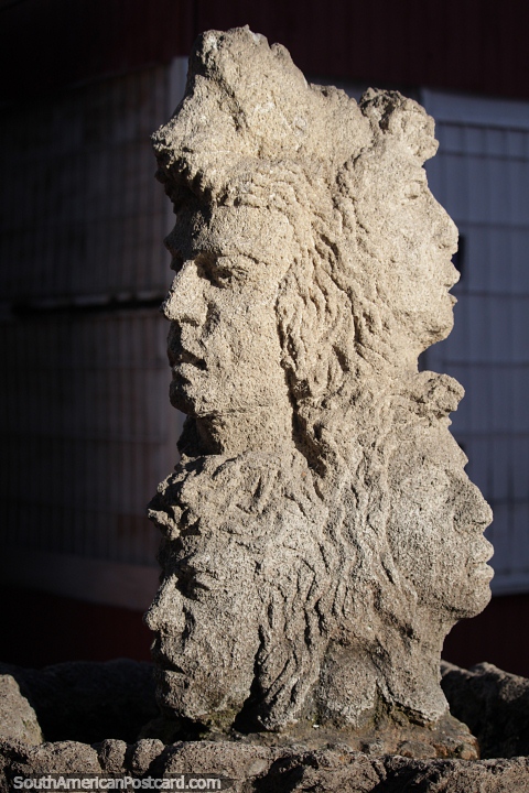 Concrete sculpture of 4 faces emerging from the same head, amazing art in La Serena. (480x720px). Chile, South America.