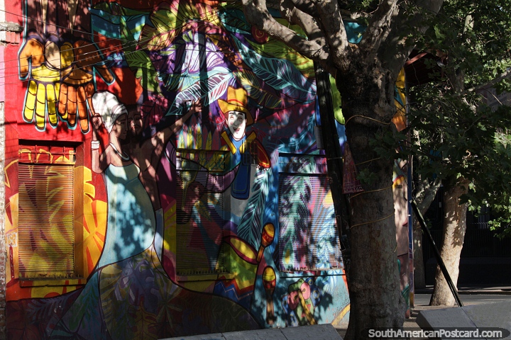 Beautiful and colorful mural covers this building on the corner in Bellavista in Santiago. (720x480px). Chile, South America.