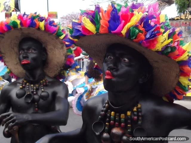 Black mumbo jumbo men pull faces for the crowds at Barranquilla Carnival. (640x480px). Colombia, South America.