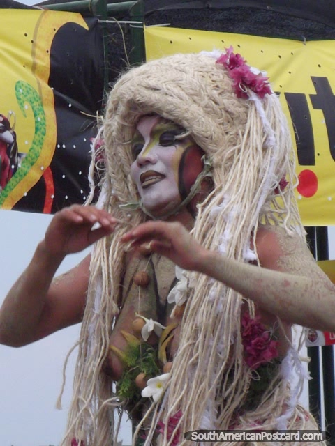 The tree woman with blond hair extensions dancing at Barranquilla Carnival. (480x640px). Colombia, South America.