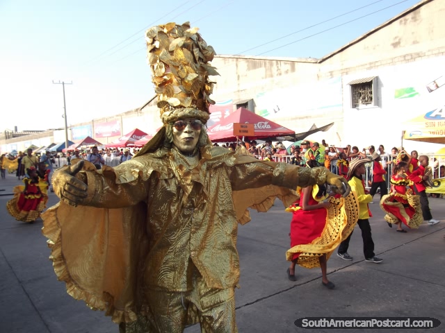 Man dressed all in gold with hat at Barranquilla Carnival. (640x480px). Colombia, South America.