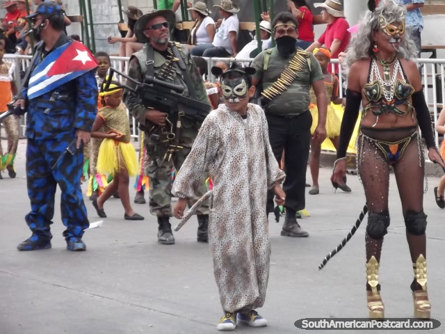A mixture of characters and impersonators including Catwoman at Barranquilla Carnival. (640x480px). Colombia, South America.