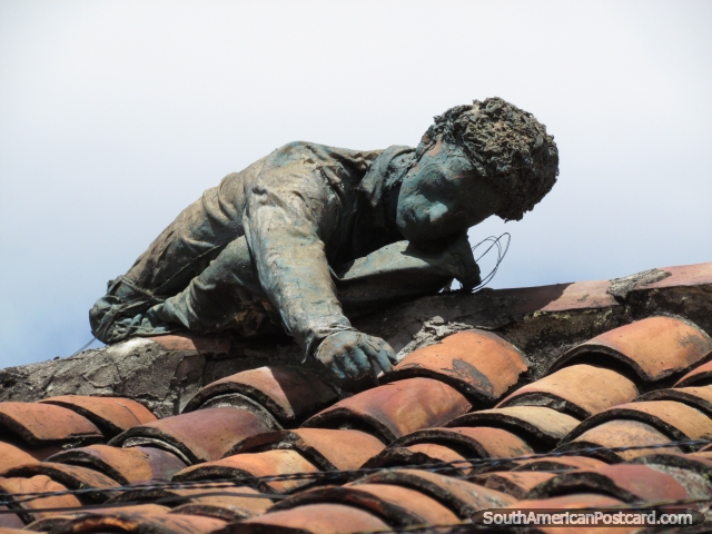 Rooftop sculpture of a person in La Candelaria, Bogota. (640x480px). Colombia, South America.