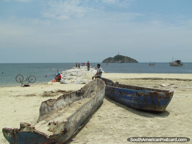 Old wooden boats and a bicycle on the beach in Santa Marta. (640x480px). Colombia, South America.