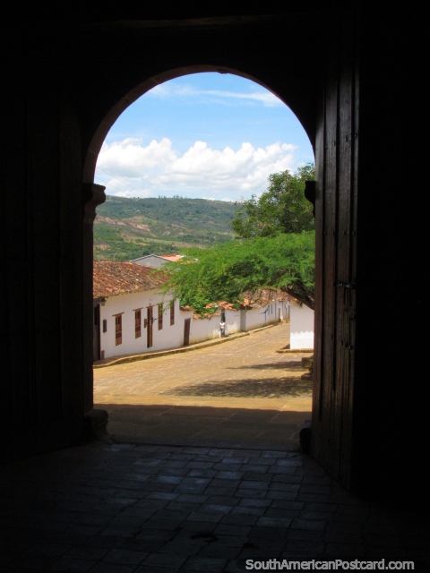 View from inside the arch doorway of Capilla de Jesus in Barichara. (480x640px). Colombia, South America.
