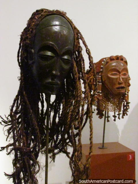 Wooden sculpted heads with hair at the National Museum in Bogota. (480x640px). Colombia, South America.
