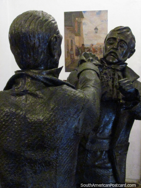 Statues of 2 men fighting, as in the painting behind at the Museo de la Independencia, Bogota. (480x640px). Colombia, South America.