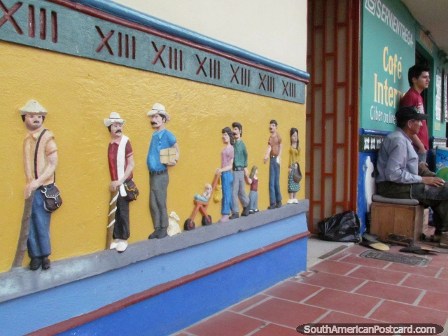 Men with hats and families walking skirting in Guatape. (640x480px). Colombia, South America.