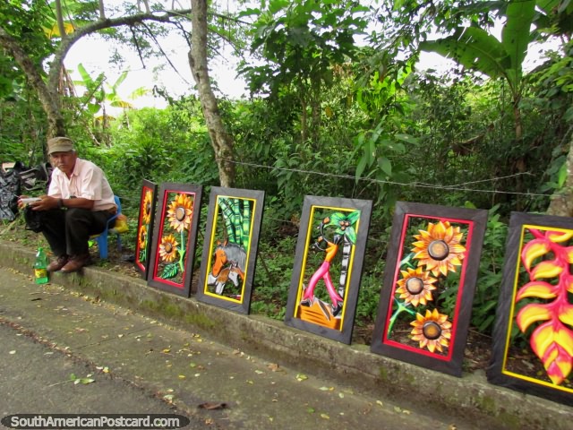 Man sells artwork along the roadside between Quimbaya and Panaca. (640x480px). Colombia, South America.