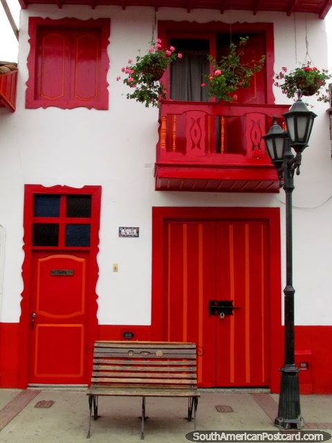 Red windows, doors and balcony, a house in Salento. (480x640px). Colombia, South America.