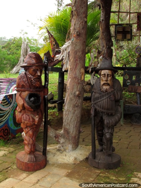 2 wooden sculptures of elder men, art in Salento. (480x640px). Colombia, South America.
