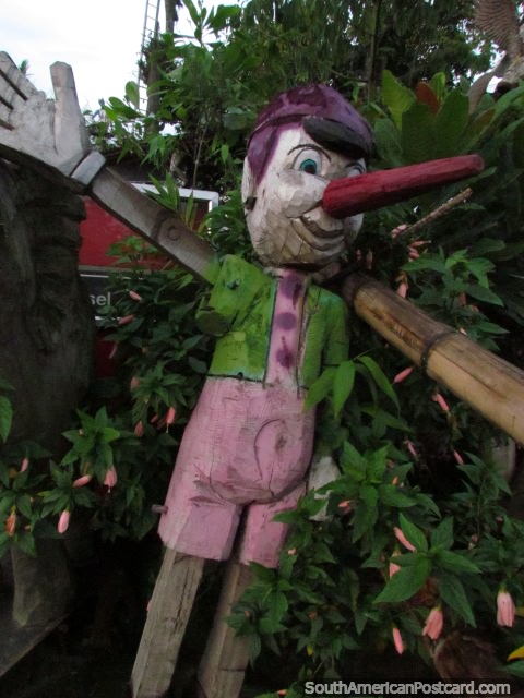Pinocchio in colorful clothes and made of wood, Armenia. (480x640px). Colombia, South America.