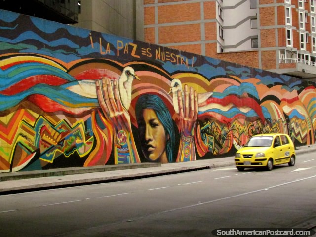 Peace is Ours, mural of hands holding birds in Bogota. (640x480px). Colombia, South America.