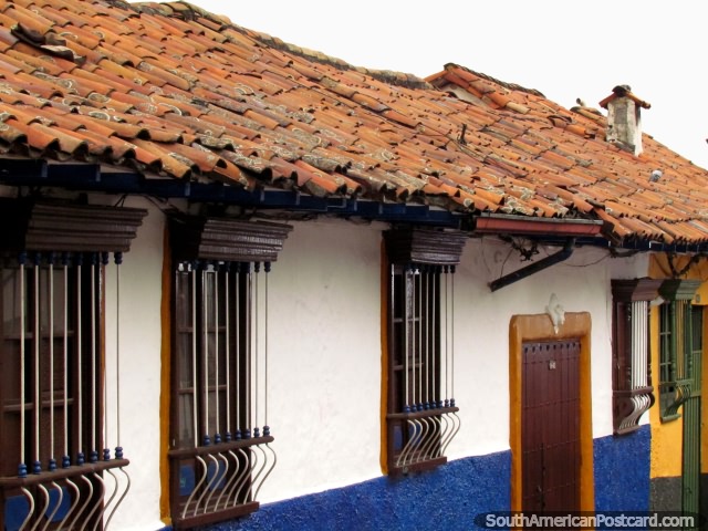 Facades and tiled roofs of houses in La Candelaria in Bogota. (640x480px). Colombia, South America.