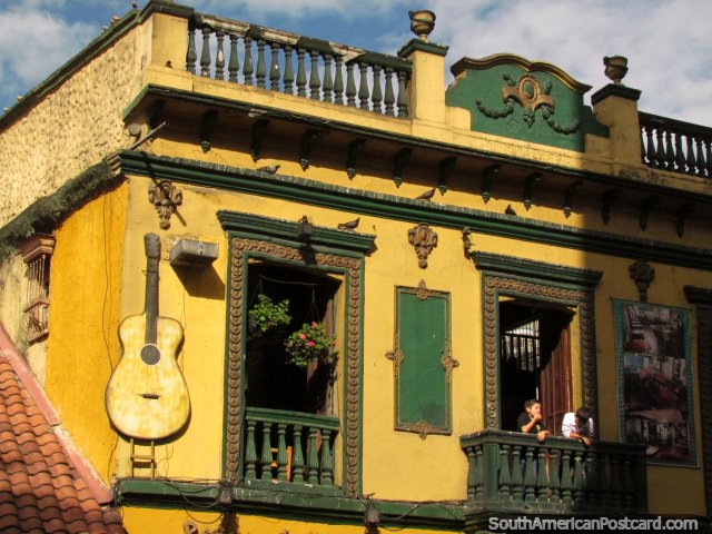 An historic building with guitar attached to the side, Bogota. (640x480px). Colombia, South America.