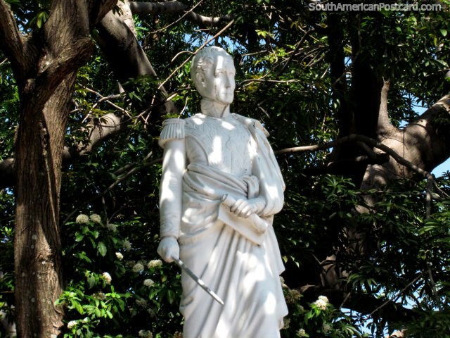 A white statue of Simon Bolivar standing with a sword and a scroll in Valledupar. (640x480px). Colombia, South America.