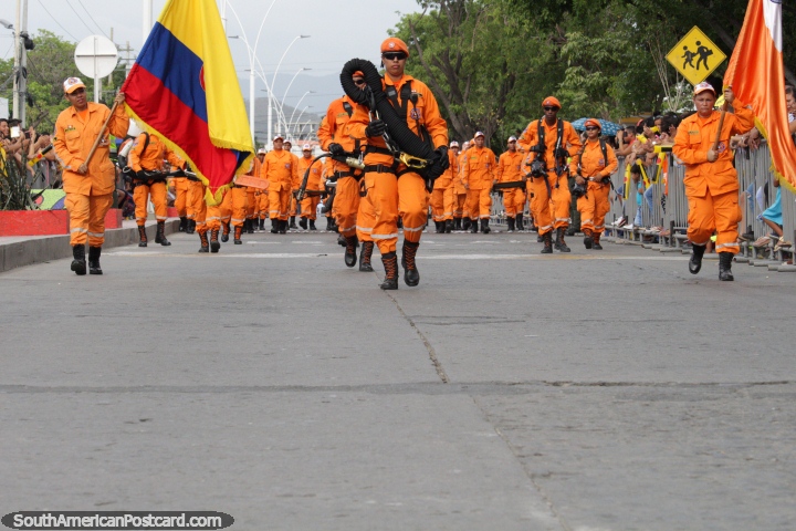 The Civil Defense Force dressed in bright orange at the Festival of the Sea in Santa Marta. (720x480px). Colombia, South America.