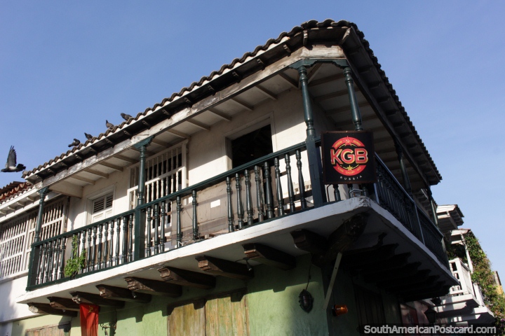 Old wooden balcony, pigeon flies away, Cartagena. (720x480px). Colombia, South America.