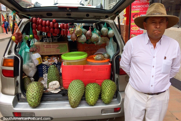 Man sells specialty foods including Guanabana from the back of his car in Tunja. (720x480px). Colombia, South America.