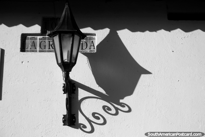 Shadow of a streetlamp in black and white, late afternoon in Villa de Leyva. (720x480px). Colombia, South America.