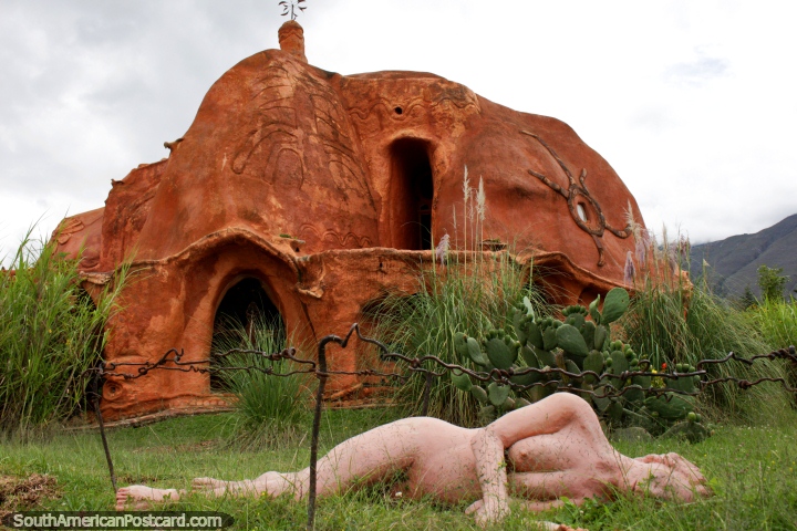 The famous Terracotta House in Villa de Leyva with a ceramic woman laying on the lawn. (720x480px). Colombia, South America.