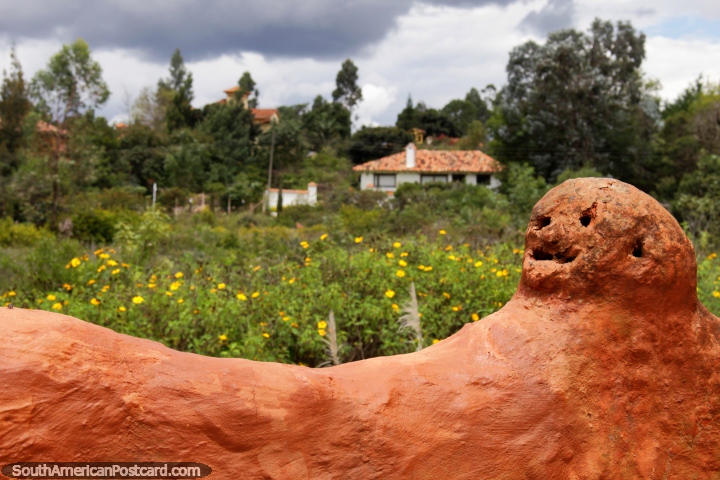 Face like a bowling ball made from ceramic and countryside views, the Terracotta House, Villa de Leyva. (720x480px). Colombia, South America.
