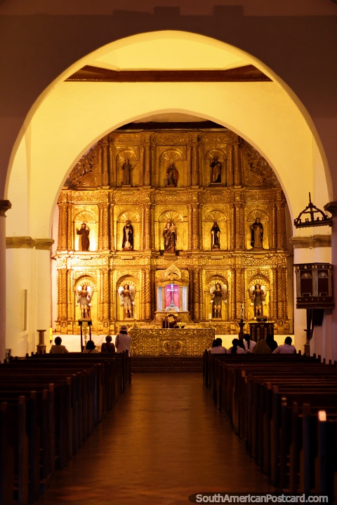 Gold interior and religious figures of the Church of Our Lady of the Rosary, Villa de Leyva. (480x720px). Colombia, South America.