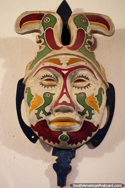 A pair of toucans at the top of this mask by Luis Alberto Acuna in Villa de Leyva. (480x720px). Colombia, South America.