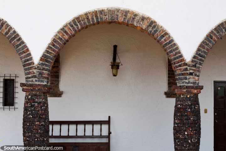 Brick arches with much more interesting Spanish architecture in Guatavita town. (720x480px). Colombia, South America.