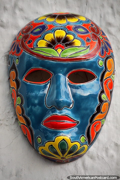 Blue ceramic mask outside the bullfighting ring in Guatavita. (480x720px). Colombia, South America.