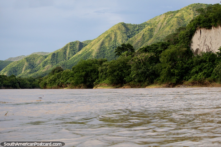 Late afternoon on the river in Girardot with the beautiful green hills glowing in the sun. (720x480px). Colombia, South America.