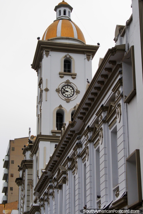 Clock and bell tower with yellow dome, the cathedral in Ibague. (480x720px). Colombia, South America.