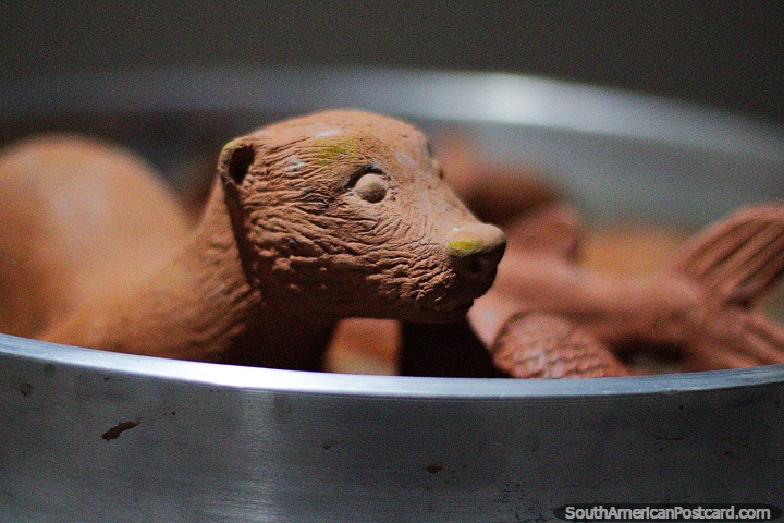 Ceramic bear in a steel bowl on display at the Tolima Art Museum in Ibague. (720x480px). Colombia, South America.