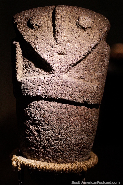 Carved from rock, a solitary figure on display at La Merced Archaeological Museum in Cali. (480x720px). Colombia, South America.