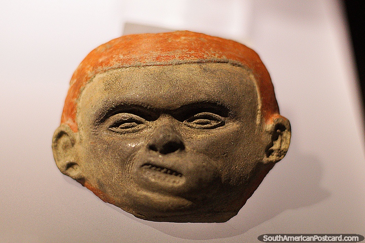 Face of a boy created with pottery, like the boy from the Mad comics, La Merced Archaeological Museum, Cali. (720x480px). Colombia, South America.