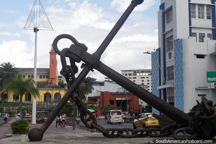 Large boat anchor outside the port in Buenaventura, cathedral in the distance. (720x480px). Colombia, South America.