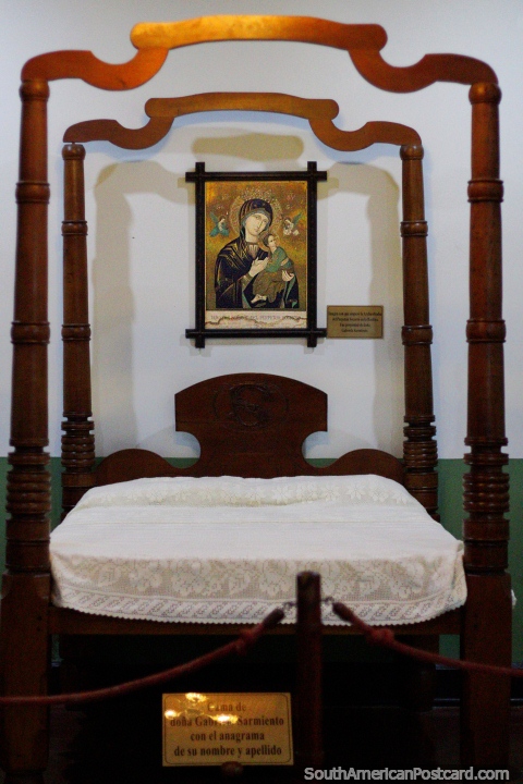 Mrs Gabriela Sarmientos bed with the anagram of her first and last name at the Lord of the Miracles Museum in Buga. (480x720px). Colombia, South America.