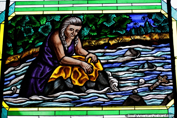 Woman washing clothes finds wooden cross in the Guadalajara River in Buga, stained glass window. (720x480px). Colombia, South America.
