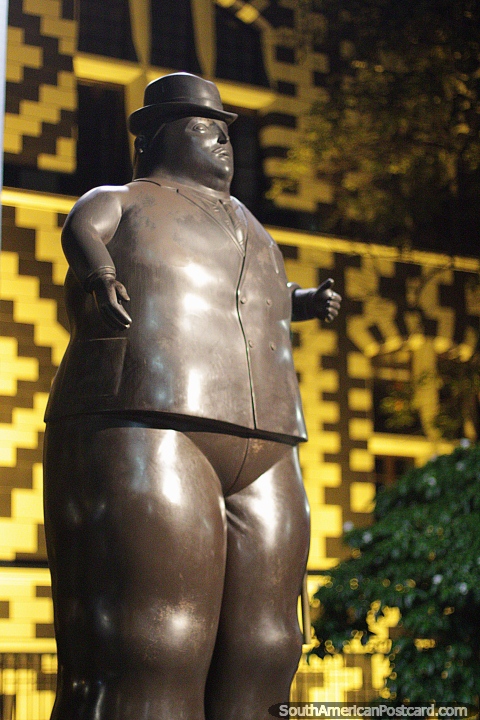 Man in a top hat, 1989, Plaza Botero in Medellin at night, a great attraction to see bronze works. (480x720px). Colombia, South America.