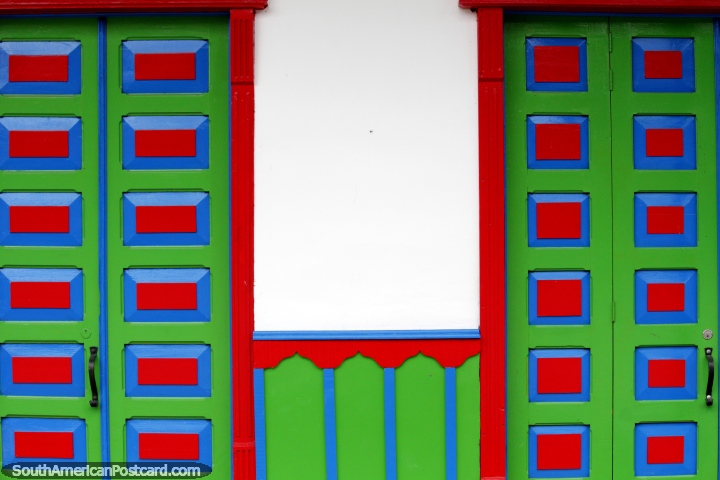 Pair of doors, almost identical, green with red squares, blue trim, Salento. (720x480px). Colombia, South America.