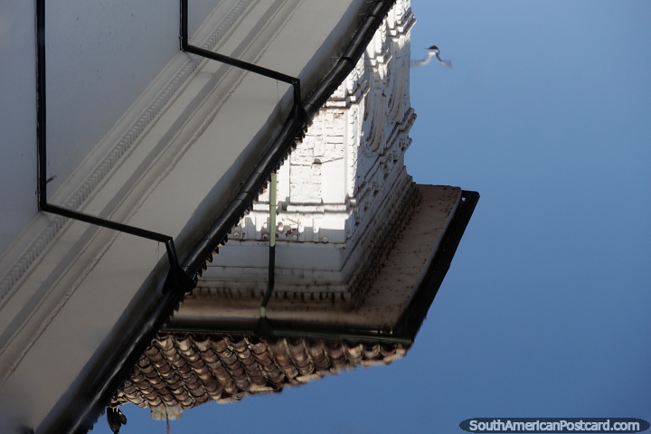 Reflection of a white building top and red tiled roof in Popayan. (720x480px). Colombia, South America.