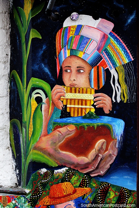 Boy with multi-colored head-wear blows wooden pipes, great street art in Pasto. (480x720px). Colombia, South America.