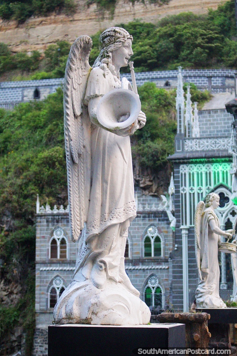 Angel with wings blows a horn, the welcoming party at Las Lajas church in Ipiales. (480x720px). Colombia, South America.