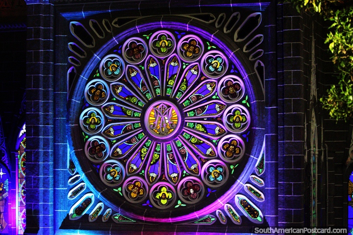 Large round stained glass window, purple with much detail and color, the church of Las Lajas.  (720x480px). Colombia, South America.