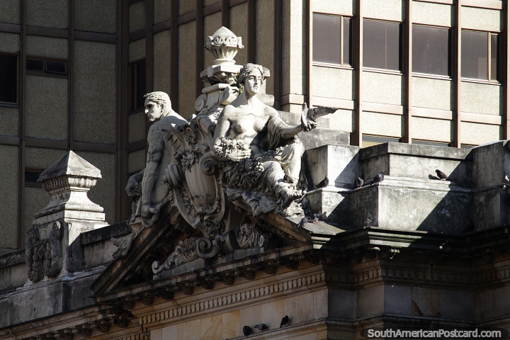 Man and woman, 2 stone figures as part of a facade on an important building in Bogota. (720x480px). Colombia, South America.