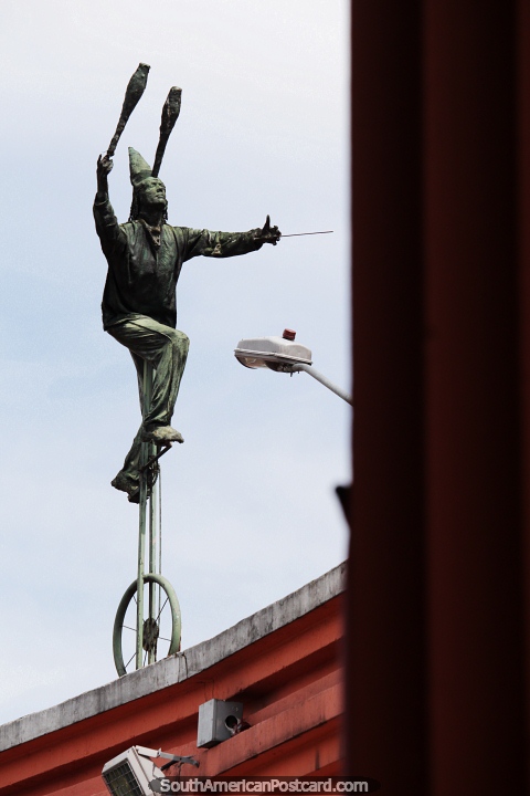 Juggling while riding a unicycle, bronze figure above Plaza del Chorro Quevedo in Bogota. (480x720px). Colombia, South America.