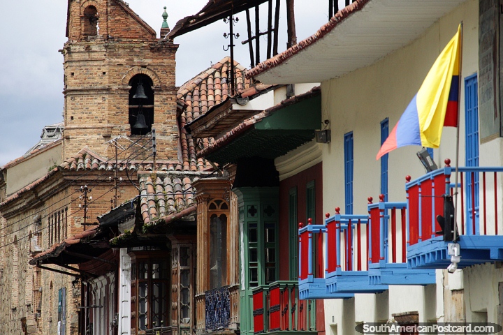 An old brick bell tower and colorful wooden balconies in central Bogota. (720x480px). Colombia, South America.